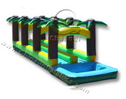 long inflatable water slide palm tree jungle